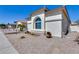 Charming home featuring desert landscaping and a unique architectural window at 17988 W Deneen Way, Surprise, AZ 85374