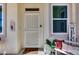 Inviting front entry featuring a security screen door, decorative accents, and a warm welcome mat at 17988 W Deneen Way, Surprise, AZ 85374