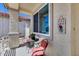 Welcoming front porch with cozy seating and charming decor, creating an inviting entry to the home at 17988 W Deneen Way, Surprise, AZ 85374