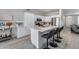 Kitchen with a center island, bright white cabinets, and stainless steel appliances at 17988 W Deneen Way, Surprise, AZ 85374