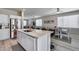View of kitchen island with open concept to dining and living spaces at 17988 W Deneen Way, Surprise, AZ 85374