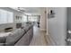 Spacious living room featuring open-concept design, wood-look floors, and ample natural light perfect for entertaining at 17988 W Deneen Way, Surprise, AZ 85374