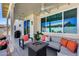 Covered patio featuring modern seating area with fire pit and outdoor decor at 17988 W Deneen Way, Surprise, AZ 85374