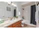 Bathroom with granite countertop, a large mirror, and a shower-tub combo at 1946 E Kings Ave, Phoenix, AZ 85022