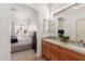 Bathroom features dual sinks, granite counters, and easy access to the cozy main bedroom at 1946 E Kings Ave, Phoenix, AZ 85022