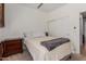 Bedroom with a ceiling fan, neutral walls, and a view of the closet and hallway at 1946 E Kings Ave, Phoenix, AZ 85022