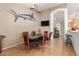 Dining room featuring a statement marlin decoration, tile floor, and a modern light fixture at 1946 E Kings Ave, Phoenix, AZ 85022