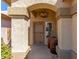 Welcoming entryway with an arched porch, decorative columns, and a stylish chandelier fixture at 1946 E Kings Ave, Phoenix, AZ 85022