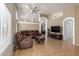 Spacious living room with high ceilings, tile floors, and a comfortable leather sectional sofa at 1946 E Kings Ave, Phoenix, AZ 85022