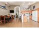 Open-concept living space with tiled floors seamlessly connecting the dining area and kitchen at 1946 E Kings Ave, Phoenix, AZ 85022