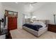 Cozy main bedroom featuring plush carpeting, a ceiling fan, and ample natural light at 1946 E Kings Ave, Phoenix, AZ 85022
