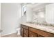 Bathroom featuring double sinks, granite countertops, and a walk-in shower at 21292 N 270Th Dr, Buckeye, AZ 85396
