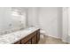 Stylish bathroom with a granite vanity, ample lighting, and a tub with shower at 21292 N 270Th Dr, Buckeye, AZ 85396