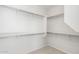 Walk-in closet with sturdy shelving and rods provides ample storage space at 21292 N 270Th Dr, Buckeye, AZ 85396