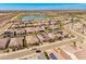 Picturesque aerial view of a residential area with homes near a lake and green spaces at 24270 N 173Rd Ave, Surprise, AZ 85387