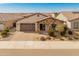 Well-maintained single-Gathering home in a desirable neighborhood with beautiful desert landscaping and inviting curb appeal at 24270 N 173Rd Ave, Surprise, AZ 85387