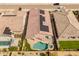Backyard features a pool, spa, and solar panels on the home's roof at 24270 N 173Rd Ave, Surprise, AZ 85387