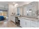 Elegant bathroom features dual vanities, granite countertops, and a well-lit vanity area with ample storage at 24270 N 173Rd Ave, Surprise, AZ 85387