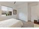 Cozy bedroom with bright lighting, neutral paint, and a closet with sliding doors for extra space at 24270 N 173Rd Ave, Surprise, AZ 85387