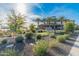 The community center with a putting green and signage surrounded by lush landscaping at 24270 N 173Rd Ave, Surprise, AZ 85387