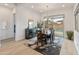 Elegant dining area with a modern chandelier and backyard view at 24270 N 173Rd Ave, Surprise, AZ 85387