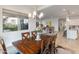 Dining room featuring a dark wood table and a view into the living room at 24270 N 173Rd Ave, Surprise, AZ 85387