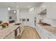 Bright kitchen featuring a large island and ample storage with open access to the living area at 24270 N 173Rd Ave, Surprise, AZ 85387