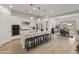 Bright, open-concept kitchen boasts a large island, stainless steel appliances, and seamless flow to the dining area at 24270 N 173Rd Ave, Surprise, AZ 85387