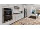 Well-equipped kitchen with stainless steel appliances and granite countertops at 24270 N 173Rd Ave, Surprise, AZ 85387