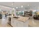 Open concept kitchen with center island and easy access to the backyard at 24270 N 173Rd Ave, Surprise, AZ 85387