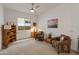 Comfortable living space featuring carpet flooring and cozy seating arrangement at 24270 N 173Rd Ave, Surprise, AZ 85387