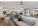 Spacious living room with patio access and a view of the kitchen at 24270 N 173Rd Ave, Surprise, AZ 85387