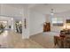 Open-concept living space with direct access to kitchen and backyard dining at 24270 N 173Rd Ave, Surprise, AZ 85387