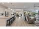 Spacious open floor plan connects the kitchen, dining area, and living room, perfect for entertaining at 24270 N 173Rd Ave, Surprise, AZ 85387