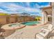 Relaxing backyard featuring a pool, spa, and comfortable seating, offering a perfect blend of leisure and style at 24270 N 173Rd Ave, Surprise, AZ 85387