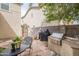 This backyard has a grill and a table with seating for outdoor relaxation at 2469 S Sailors Ct, Gilbert, AZ 85295