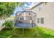 The spacious backyard features a trampoline on the well-maintained lawn, perfect for outdoor play and recreation at 2469 S Sailors Ct, Gilbert, AZ 85295