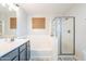 Bright bathroom with a soaking tub, glass-enclosed shower, and modern vanity at 2469 S Sailors Ct, Gilbert, AZ 85295