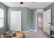This bedroom features large closet doors and views of the upstairs hall at 2469 S Sailors Ct, Gilbert, AZ 85295