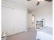 This bedroom features large closet doors and a ceiling fan at 2469 S Sailors Ct, Gilbert, AZ 85295