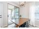 Breakfast nook with modern light fixture with sliding door access to the patio at 2469 S Sailors Ct, Gilbert, AZ 85295