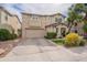 Charming two-story home features a two car garage, fresh landscaping, and cozy covered entryway at 2469 S Sailors Ct, Gilbert, AZ 85295