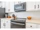 Kitchen has modern stainless steel appliances and ample storage space at 2469 S Sailors Ct, Gilbert, AZ 85295
