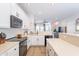 Kitchen features white cabinetry, stainless appliances, and a serving bar at 2469 S Sailors Ct, Gilbert, AZ 85295