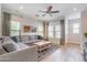 Bright living room featuring hardwood floors, modern decor, and neutral paint at 2469 S Sailors Ct, Gilbert, AZ 85295