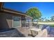 Backyard patio offering stunning views of the golf course and blue skies beyond at 25273 S Berry Brook Dr, Sun Lakes, AZ 85248