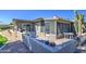 Backyard with an enclosed patio ideal for relaxation and entertainment with golf course views at 25273 S Berry Brook Dr, Sun Lakes, AZ 85248