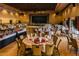 Stately ballroom featuring formal dining tables and chairs set up near an elevated stage area at 25273 S Berry Brook Dr, Sun Lakes, AZ 85248