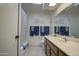 Bright bathroom with a bathtub, towel racks, and vanity with framed mirror and coordinated decor at 25273 S Berry Brook Dr, Sun Lakes, AZ 85248