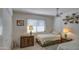 Bright and comfortable bedroom with a ceiling fan and large windows at 25273 S Berry Brook Dr, Sun Lakes, AZ 85248